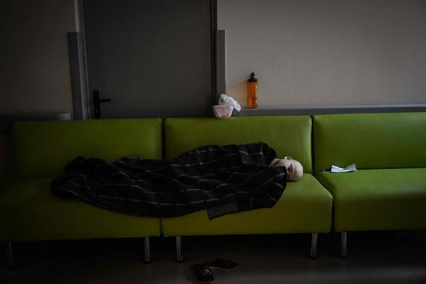 "Where will the children of the refugees go?" A child struggling with cancer sleeps on a sofa after being evacuated to the basement of the oncology centre which is being used as a bomb shelter, in Kyiv, Ukraine, Feb 28, 2022