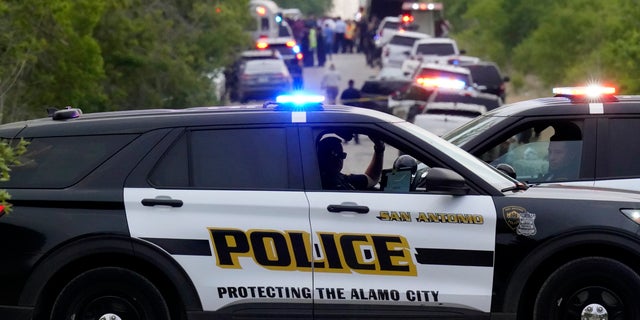 Police block the scene where a semitrailer with multiple dead bodies was discovered, Monday, June 27, 2022, in San Antonio. 
