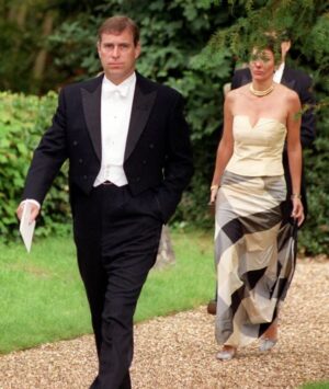 Prince Andrew walks ahead of the Ghislaine at a wedding in 2000