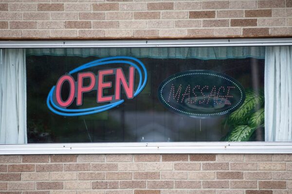 Signs in the windows Thursday, July 7, 2022, at Best Chinese Massage on Indiana 933 north of South Bend.