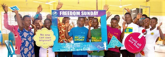Some survivors of child trafficking in Freedom Sunday T-shirts with members of the Youth Ministry of the Divine Healer’s Church after the service