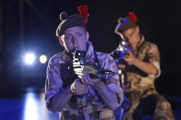 Actors Ryan Fletcher who plays Kenzie, left, and Emun Elliott who plays Fraz pictured in a scene from the National Theatre of Scotland production Black Watch at the Freud Playhouse at the UCLA, Los Angeles, California.