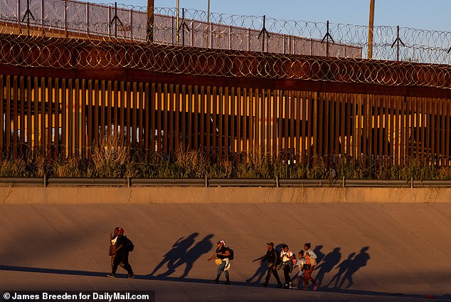 Migrants cross the Rio Grande river from Ciudad Juarez in Mexico to El Paso, in the U.S. Jaeson Jones, a former Texas lawman, says they must repay a debt to the cartels that assisted them to the border