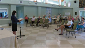 Ocean Springs author Johnnie Bernhard spoke to a crowd of about 40 people before reading an excerpt from her novel about human trafficking.