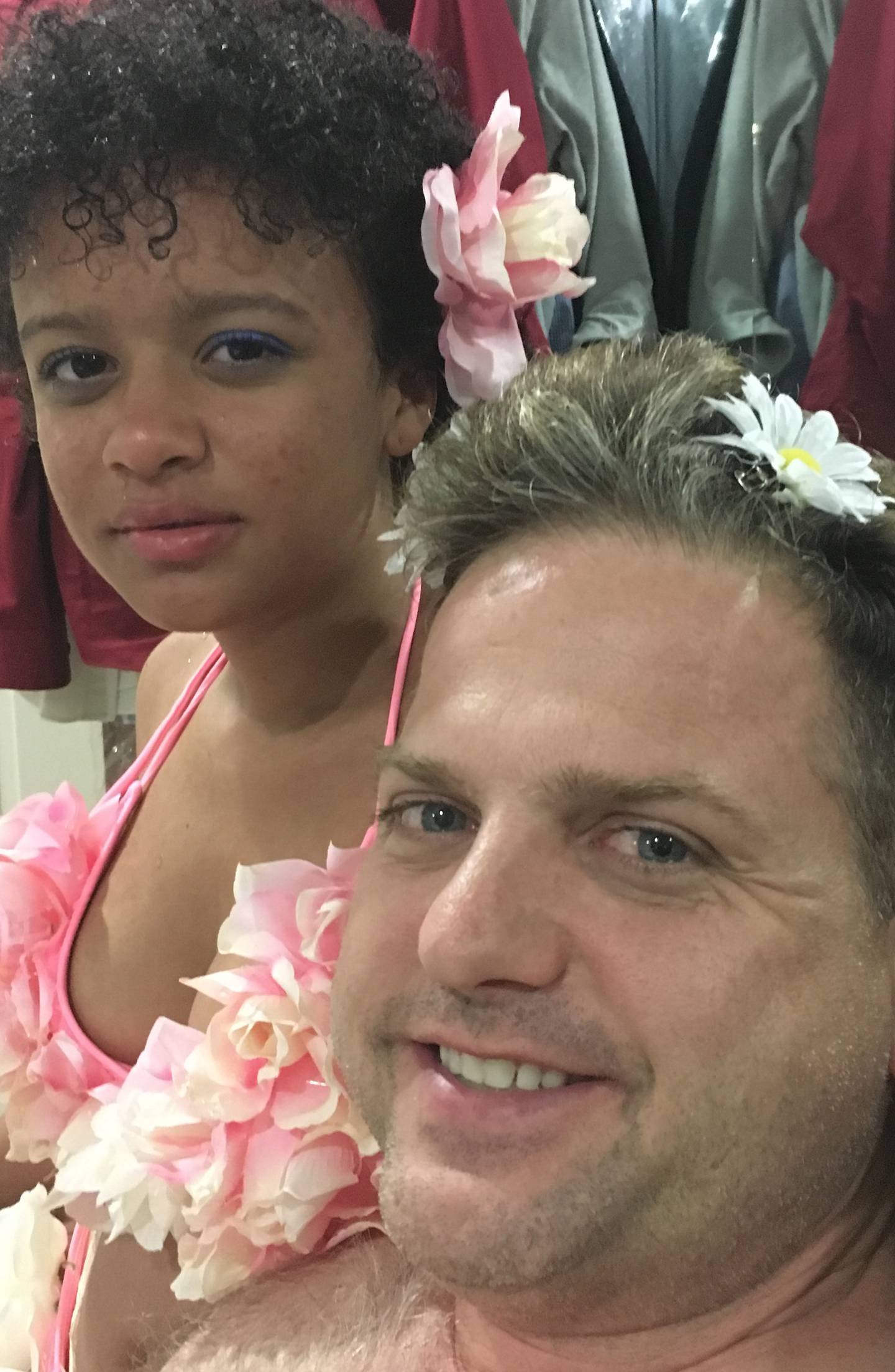 Sophie Reeder spent her last day at home gluing artificial flowers around her room. She put a daisy in her father Patrick Reeder's hair for this selfie.