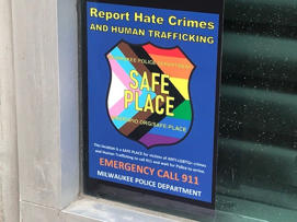 The Safe Space initiative decal located at Fiserv Forum's service entrance on Highland Avenue near North 6th Street.