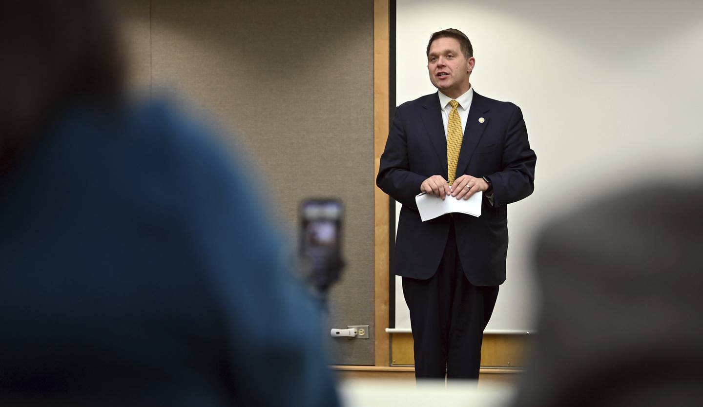 Eric F. Rinehart, Lake County state's attorney, addresses the audience at the Human Trafficking Awareness Candle Vigil on Jan. 30, 2023 at the Waukegan Public Library in the Ray Bradbury Room.
