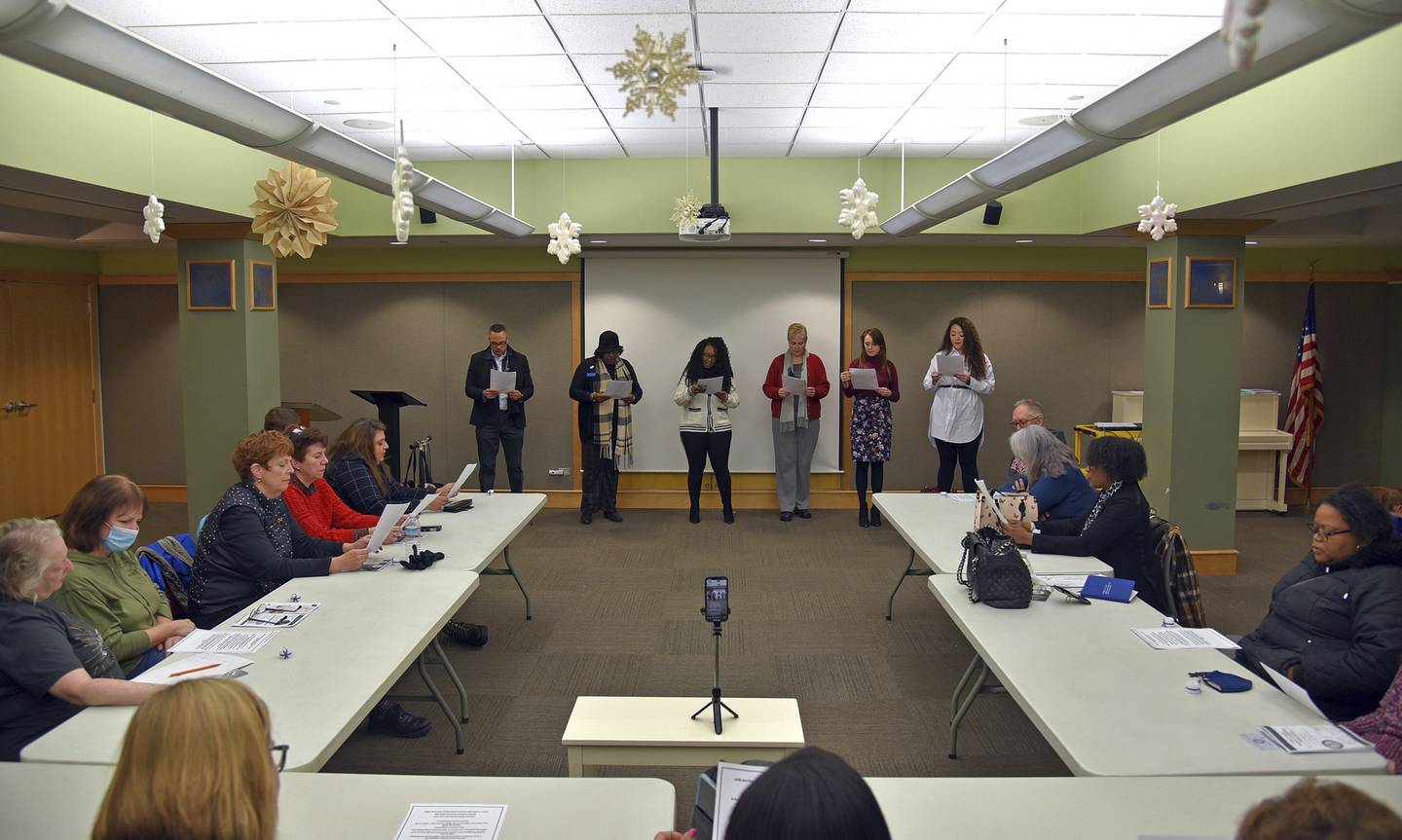 The collective statement is being read at the front of the room at the Human Trafficking Awareness Candle Vigil on Jan. 30, 2023 at the Waukegan Public Library in the Ray Bradbury Room.