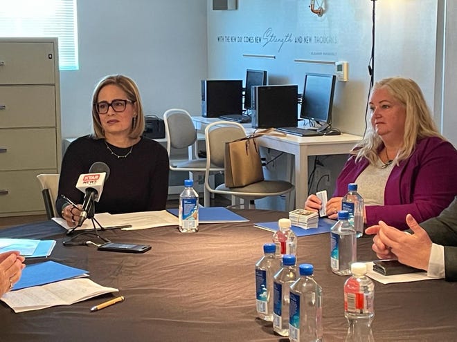 Sen. Kyrsten Sinema, I-Ariz., discusses human trafficking with NFL officials and others at a Feb. 10, 2023, roundtable in west Phoenix.