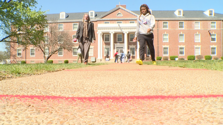 Red sand fills sidewalk cracks at local university – WBBJ-TV