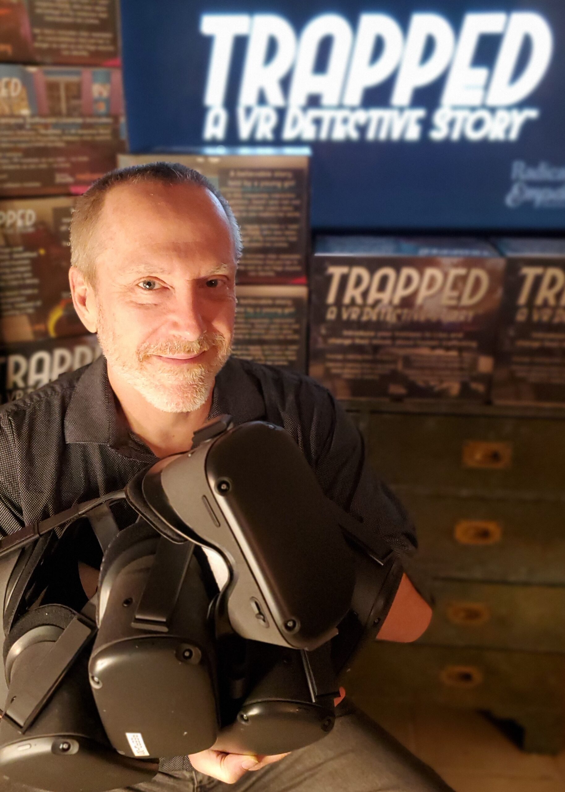Billy Joe Cain Headshot with TRAPPED and Quest VR headsets 1828x2560