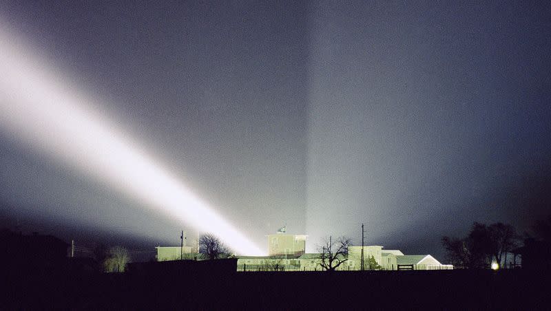 In this March 22, 1993 file photo, a spotlight shines over the Branch Davidian compound near Waco, Texas. The Branch Davidians were often described as a cult by journalists and law enforcement officials.