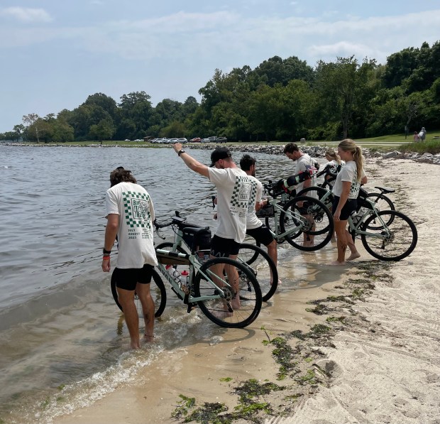 The six cyclists from Bike Against Traffic ended their 3,775-mile cross-country journey by dipping their tires into the York River. Alison Johnson/freelance