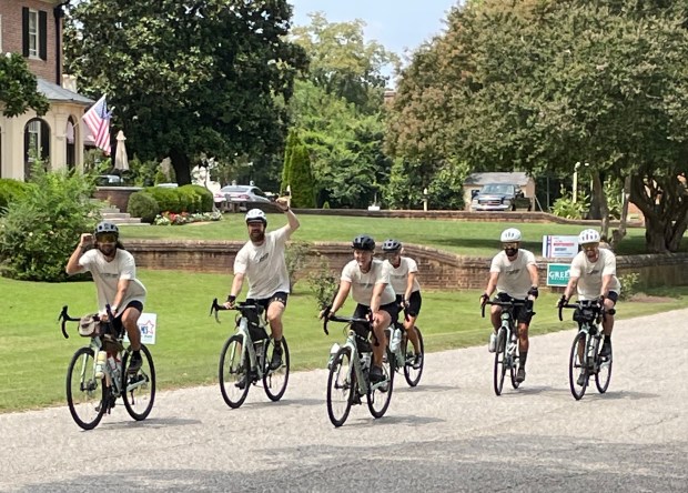 After starting in Florence, Oregon, on July 1, a group of cyclists who rode cross country to raise awareness and funds to combat human trafficking ended in Yorktown on Aug. 22. Here, they are in their home stretch before ending at the Yorktown Victory Monument. Alison Johnson/freelance
